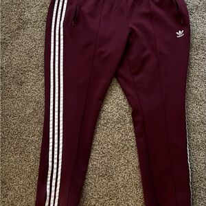 Adidas Women’s Burgundy Joggers with White Stripes